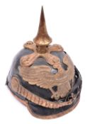 A copy of an 1860 Prussian officer's pickelhaube, with brass mounts, officer's pattern cockades,