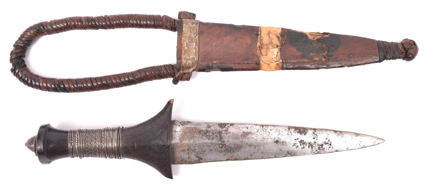 A Sudanese arm dagger, plain blade 6" with maker's mark on each side, plain ebony hilt with loose