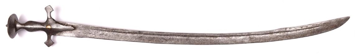 An Indian tulwar, blade 31½" with 8" back edge, crudely etched for its entire length with animals