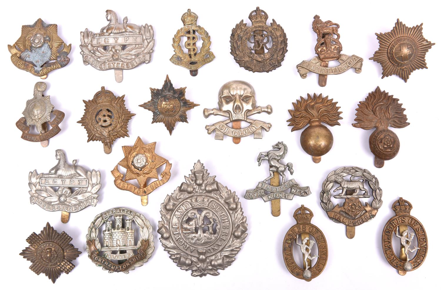 21 cap badges, comprising 17/21st Lancers, 4 Guards (no Welsh), 10 Infantry and 6 Corps. Average