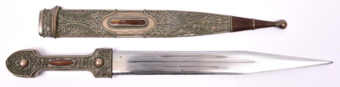 A decorative 20th century Caucasian kindjal, blade 11", the white metal hilt and sheath decorated on