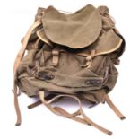 A WWII British Army Bergen rucksack, green canvas with brass and leather fittings, dated 1945, GC £