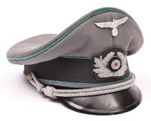 A Third Reich type army officers peaked cap, alloy wire badge and chin cords, alloy eagle badge,