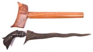 A Sumatran kris, wavy pamir blade 11½", the dark wood garuda hilt having a grey metal mount, in