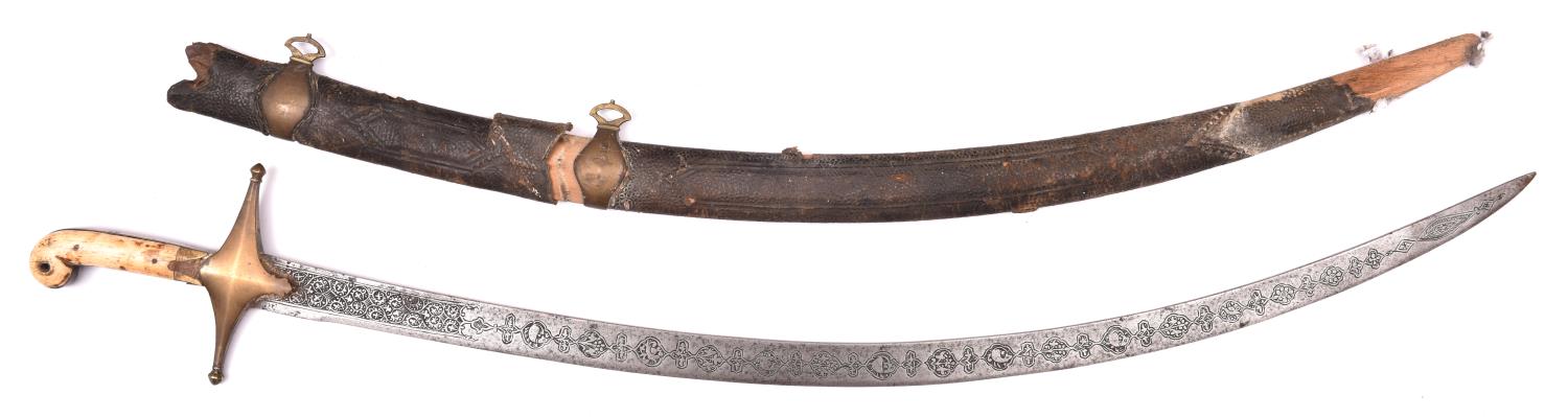 A Persian shamshir, blade 33" with chiselled panels for its entire length depicting foliage and