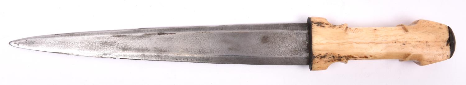 A Sudanese dagger, the imported tapered 9½" blade of watered steel, with one piece bone hilt and - Image 2 of 2