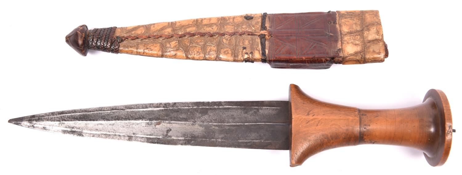 A Sudanese arm dagger, fluted blade 7" with central rib, plain wood hilt with turned upper part - Image 2 of 2
