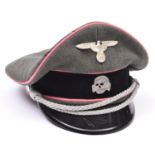 A Third Reich SS Panzer officer's peaked cap, with metal skull and eagle, silver bullion cords,