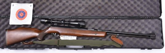 A .22" Weihrauch HW77 underlever air rifle, number 1048818, the dark beech wood stock having