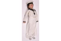 A small boys white sailor suit, comprising hat with HMS Ganges cap tally, sleeved top and