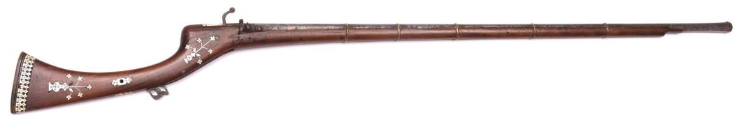 An Indian matchlock jezail, octagonal barrel 43" with slightly flared muzzle and inlaid with a