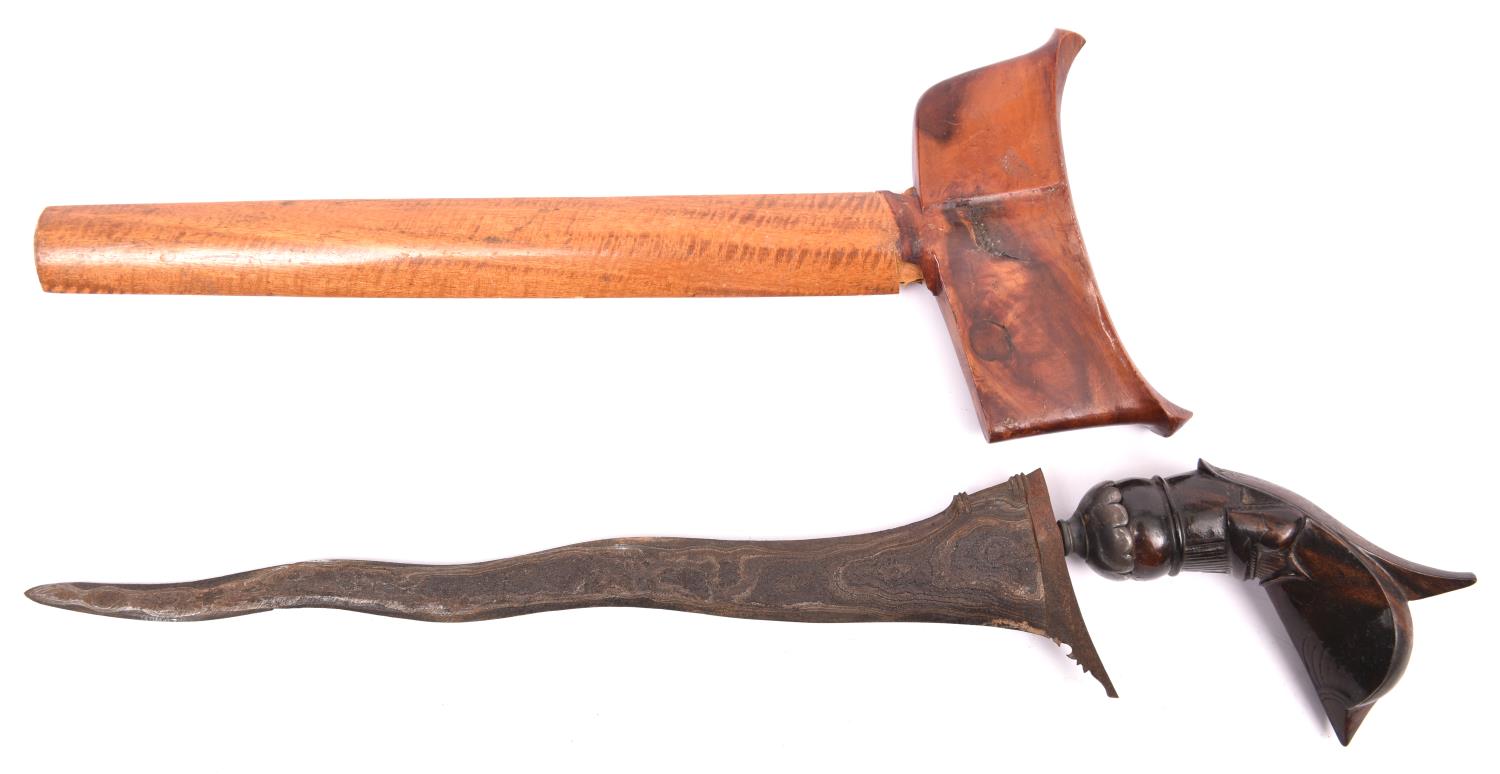 A Sumatran kris, wavy pamir blade 11½", the dark wood garuda hilt having a grey metal mount, in - Image 2 of 2