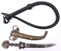 A Moroccan jambiya, the hilt with wooden grip and brass mounts partly overlaid with thin sheet