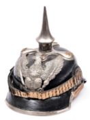 A copy of a Prussian officer's pickelhaube, with white metal mounts and helmet plate, officers