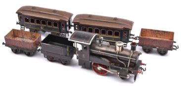 A Bing Gauge 2 (2" / 50.8mm) tinplate Storkleg locomotive and train set. A Live steam spirit