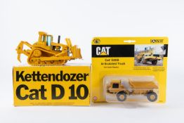 2 heavy plant/construction equipment. Caterpillar Kettendozer Cat D10. Plus a Norscot Cat D25D