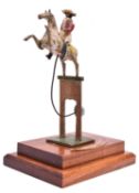 A rare 19th Century wooden kinetic Toy. A mounted soldier with the horse in a prancing position,