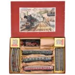 A Marklin 3 rail train set 3205. Comprising a German Railways 2-6-2 tender locomotive in black and