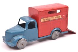 A rare unamed British manufacturer.Metal horse box with blue cab and red horse box. Paper