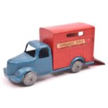 A rare unamed British manufacturer.Metal horse box with blue cab and red horse box. Paper