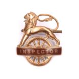 British Railways (Western Region) INSPECTOR cap badge. Brass and brown enamel lion over wheel,