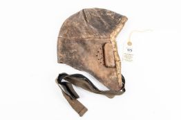 A WWI type leather flying helmet, badly eaten by moth; also a pair of RFC wings, QGC £150-180