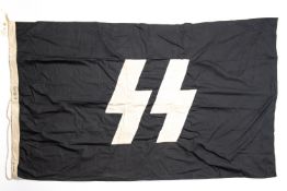 A Third Reich SS black flag, 85cm x 150cm, white SS runes stitched on. GC £65-70