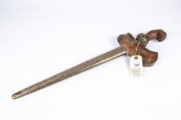 A good Malay kris, 2 tone wavy blade 12½", heavily carved wood hilt with jewelled brass base
