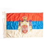 A WWI Serbian flag, 36" x 22", printed with coat of arms centre motif. GC £65-70