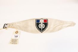 A WWII Free French arm band, white cloth with wheeled sword badge. GC £40-60