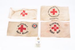 A Third Reich Red Cross arm band, 3 more varying types and an enamel badge. GC £50-60