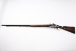 A late 18th century 10 bore flintlock fowling piece, by Hunt of Colchester, barrel 42" with London