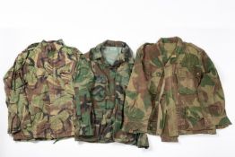 A 1950s Belgian Army Airborne smock; a US frog and leaf smock and a British 1968 pattern camo