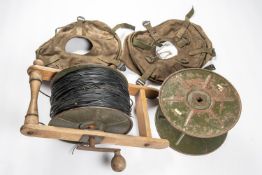 A reel of DIO assault cable, with wooden laying frame; also another empty reel and 2 canvas reel