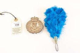 A post 1953 London Irish Rifles piper's silver plated Caubeen badge; and companion blue feather