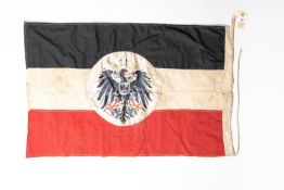 A WWI Imperial German flag, 36" x 23", printed eagle centre piece, edge stamped "Schutztruppe,
