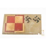 A rectangle of sheet aluminium, decorated with 2 swastikas and red and white chequered square. GC £