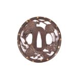 A Bushu School tsuba, 73mm x 67mm, depicting plum blossom and gold foliage around the mimi (rim) £