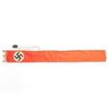 A Third Reich funeral sash of silver alloy, fringed red material, 50" x 6", swastika motif; also