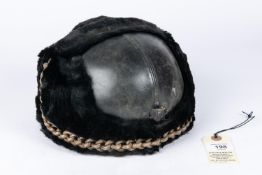 A pre WWII RAF full dress parade helmet, leather covered with fur trim, silk lining, and patent