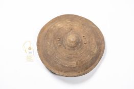 An old Somali small hide shield, 13" diameter, decorated overall with concentric rings and with