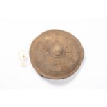 An old Somali small hide shield, 13" diameter, decorated overall with concentric rings and with