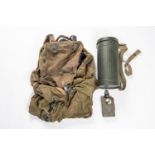 A Third Reich Alpine type rucksack; a gas mask canister marked "TSR 1941"; also a German belt torch.