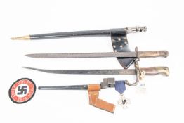A French 1874 Gras bayonet (the blade shortened and bent); a 1907 SMLE bayonet (deeply pitted