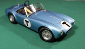 A Racing Legends 1/18 Ford Cobra 260. An example in light metallic blue with black interior, 'T'