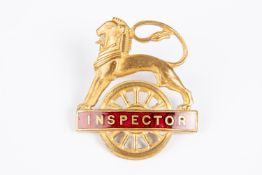 British Railways (Midland Region) INSPECTOR cap badge. Brass and red enamel lion over wheel, with