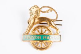 British Railways (Southern Region) STATION MASTER cap badge. Brass and green enamel lion over wheel,