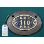 A Great Western Railway (GWR) cast iron oval plate. (135mm wide). Marked G.W.R. 110 P.W.B. mounted