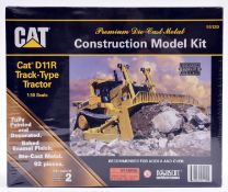 A Norscot CAT Construction Model Kit of a Cat D11R Track-Type Tractor. 1:50 scale. A metal fully