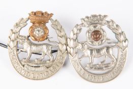 A cap badge of the 1st Vol Bn York and Lancaster Regt, GC; and another similar of the 2nd Vol Bn, (